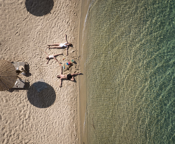 Eagles Resort Chalkidiki family lying on sand