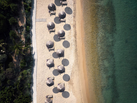 Eagles Resort Chalkidiki sandy beach with trees and umbrellas aerial view