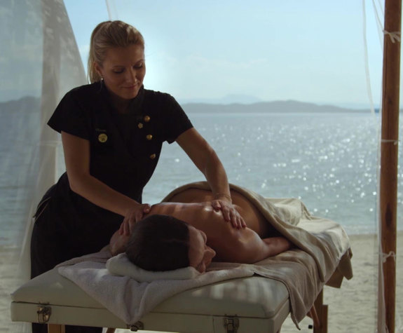 Eagles Resort Chalkidiki woman having a massage on the beach in a gazzebo