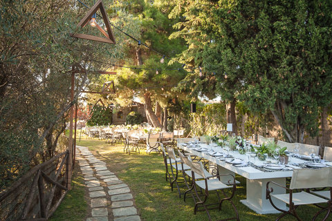 Eagles Resort Chalkidiki Wedding Events with table seats in white and under the pine trees shadow