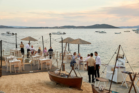 Eagles Resort Chalkidiki Armyra Restaurant by the beach with white table seats greek tavern style