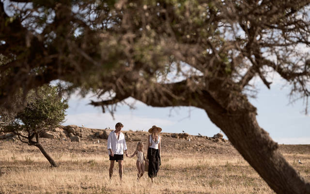 Family walking in Drenia island's nature