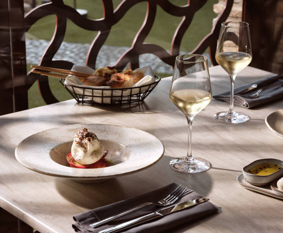 Served dining table with fine dishes and wines at Eagles Resort