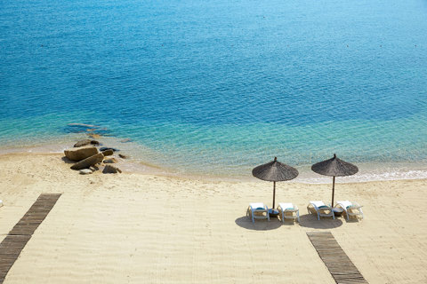 Eagles Resort Chalkidiki sandy beach with sunbeds and umbrellas