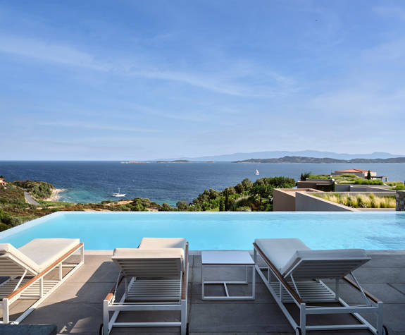 Eagles Resort Chalkidiki white sunbeds by the Pool, with sea views