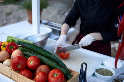 Eagles Resort Chalkidiki Armyra Restaurant chef makes greek salad with tomato and cucumber