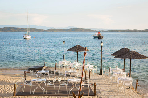 Eagles Resort Chalkidiki Armyra Restaurant by the beach and two boats