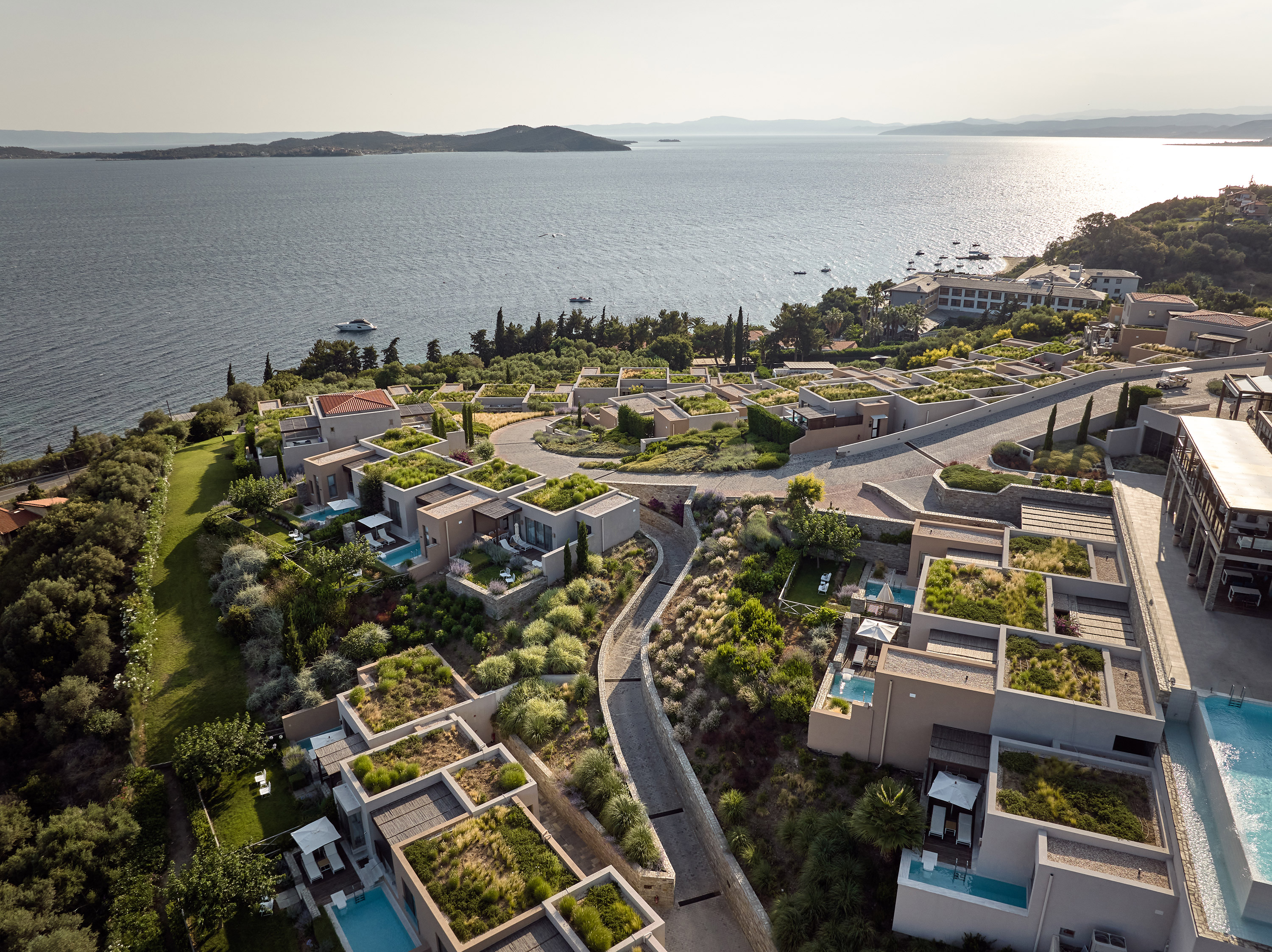 Eagles Resort Chalkidiki aerial view, pools, suites, sea, blue sky and nature