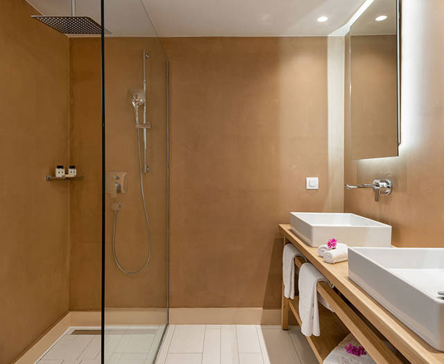 Eagles Palace Resort Chalkidiki Presidential Bungalow bedroom with shower