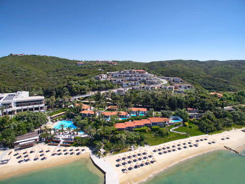 Eagles Villas Chalkidiki aerial view, pools, suites, beach front hotel, blue sky and nature
