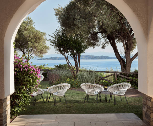 Arch frame featuring a garden seating with sea view at Eagles Resort