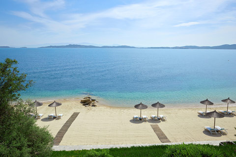 Eagles Resort Chalkidiki Private sandy beach with umbrellas and sunbeds